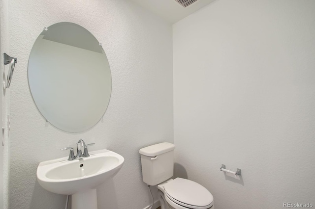 14578 W 90th Ln Unit B, Arvada, CO 80005 - bathroom featuring a sink and toilet