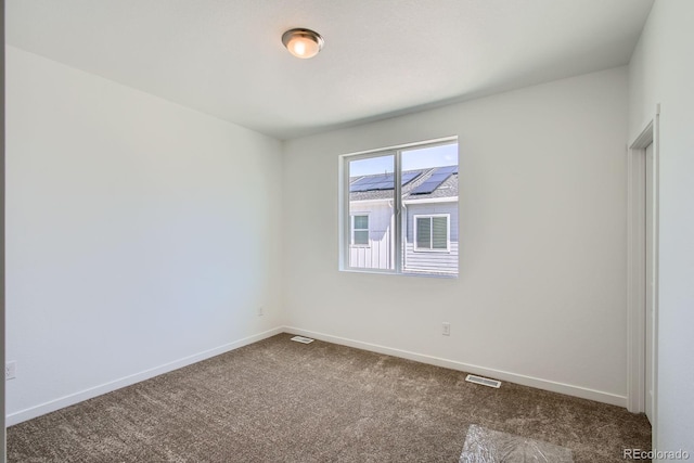 14578 W 90th Ln Unit B, Arvada, CO 80005 - spare room featuring dark carpet and baseboards