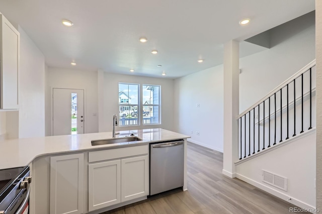 742 N Bently St, Watkins, CO 80137 - kitchen featuring stainless steel appliances, light wood finished floors, white cabinetry, light countertops, and recessed lighting