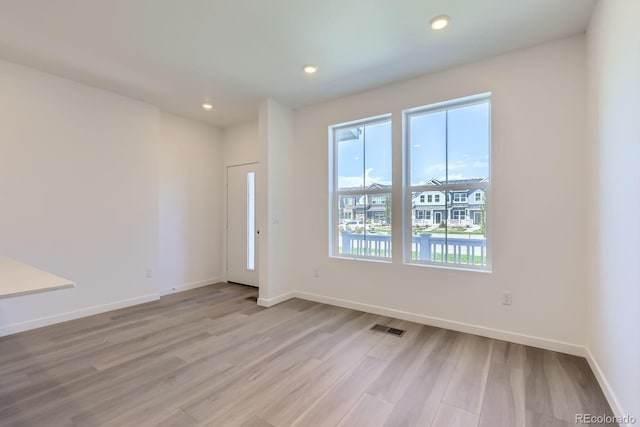 742 N Bently St, Watkins, CO 80137 - unfurnished room with light wood finished floors and recessed lighting