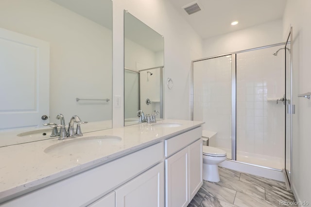 742 N Bently St, Watkins, CO 80137 - full bath featuring double vanity, a shower stall, recessed lighting, and marble look tile flooring