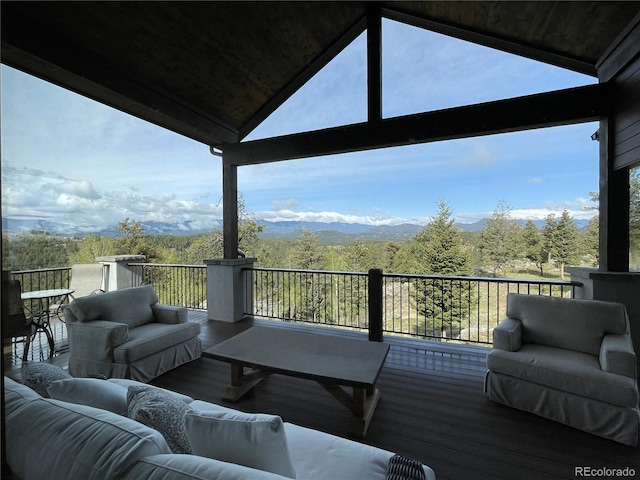 15077 Wilson Peak Rd, Pine, CO 80470 - wooden deck featuring outdoor lounge area and a wooded view