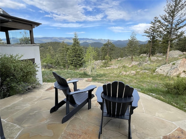 15077 Wilson Peak Rd, Pine, CO 80470 - view of patio / terrace with a mountain view and a view of trees
