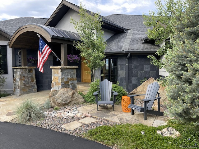 15077 Wilson Peak Rd, Pine, CO 80470 - view of front of home featuring a shingled roof and stone siding