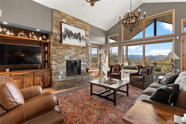 15077 Wilson Peak Rd, Pine, CO 80470 - living room with high vaulted ceiling, a chandelier, a fireplace, wood finished floors, and a mountain view