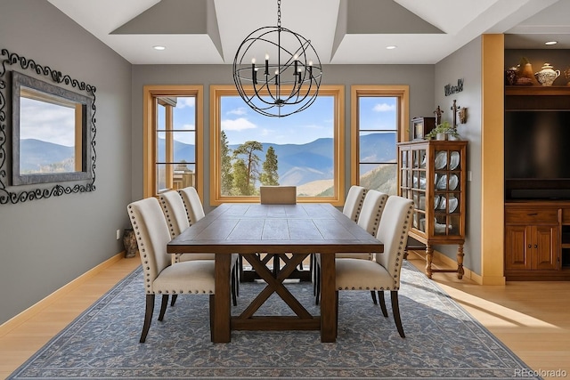 15077 Wilson Peak Rd, Pine, CO 80470 - dining room with a chandelier, wood finished floors, plenty of natural light, lofted ceiling, and recessed lighting