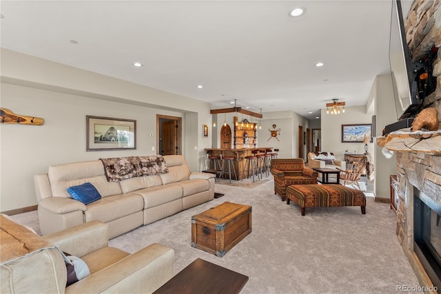15077 Wilson Peak Rd, Pine, CO 80470 - living room with light carpet, a fireplace, recessed lighting, and a chandelier