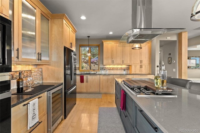 15077 Wilson Peak Rd, Pine, CO 80470 - kitchen featuring wine cooler, light brown cabinets, black refrigerator with ice dispenser, recessed lighting, and stainless steel gas cooktop