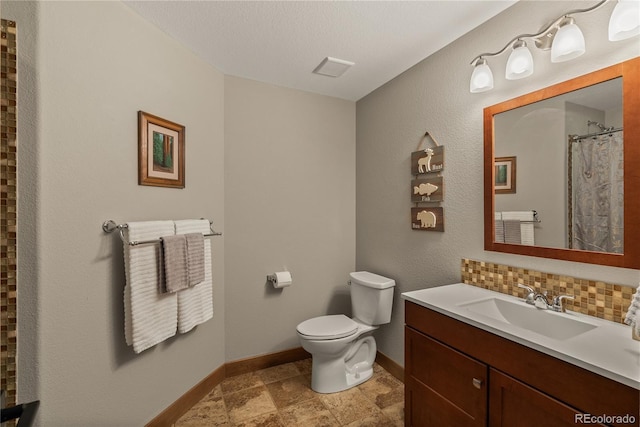 15077 Wilson Peak Rd, Pine, CO 80470 - full bathroom featuring vanity, decorative backsplash, and curtained shower
