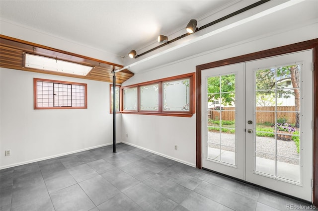 8793 E Monmouth Pl, Denver, CO 80237 - doorway to outside with french doors, baseboards, and tile patterned floors