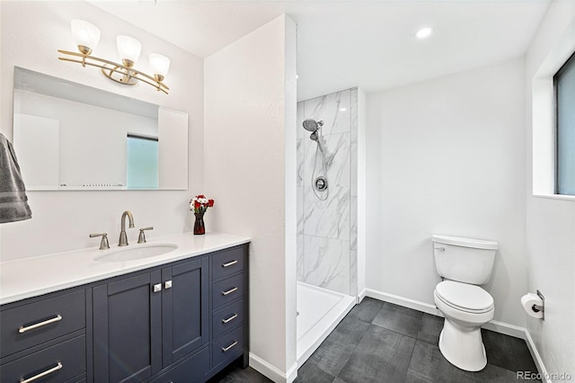 8793 E Monmouth Pl, Denver, CO 80237 - bathroom with toilet, vanity, a tile shower, and baseboards