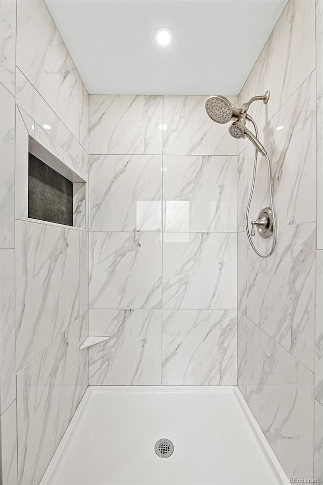 8793 E Monmouth Pl, Denver, CO 80237 - bathroom with a tile shower and recessed lighting