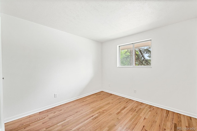 8793 E Monmouth Pl, Denver, CO 80237 - spare room with light wood-style flooring and baseboards