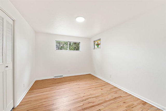 8793 E Monmouth Pl, Denver, CO 80237 - unfurnished bedroom featuring light wood-type flooring, baseboards, and a closet