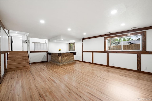 8793 E Monmouth Pl, Denver, CO 80237 - unfurnished room featuring light wood-style floors, recessed lighting, and stairway