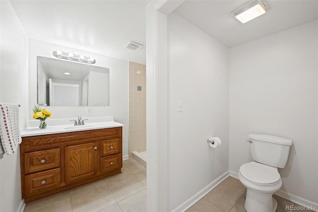 8793 E Monmouth Pl, Denver, CO 80237 - full bath featuring tile patterned floors, vanity, tiled shower, and toilet