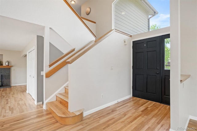 7582 Powderhorn Dr, Lone Tree, CO 80124 - foyer featuring stairway, wood finished floors, and baseboards