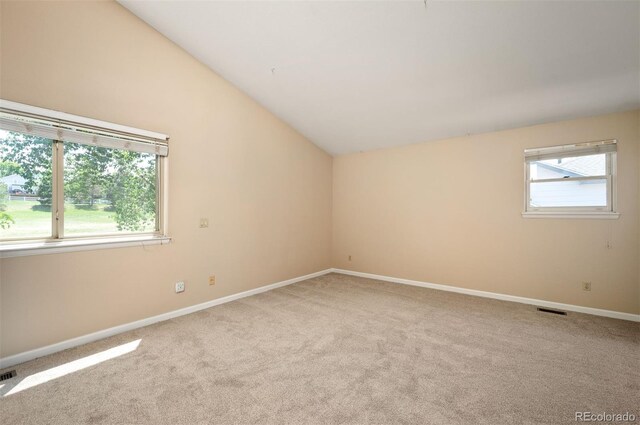 7582 Powderhorn Dr, Lone Tree, CO 80124 - empty room featuring light colored carpet, lofted ceiling, and baseboards