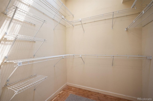 7582 Powderhorn Dr, Lone Tree, CO 80124 - spacious closet featuring wood finished floors