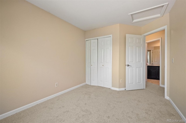 7582 Powderhorn Dr, Lone Tree, CO 80124 - unfurnished bedroom with attic access, light carpet, baseboards, and a closet