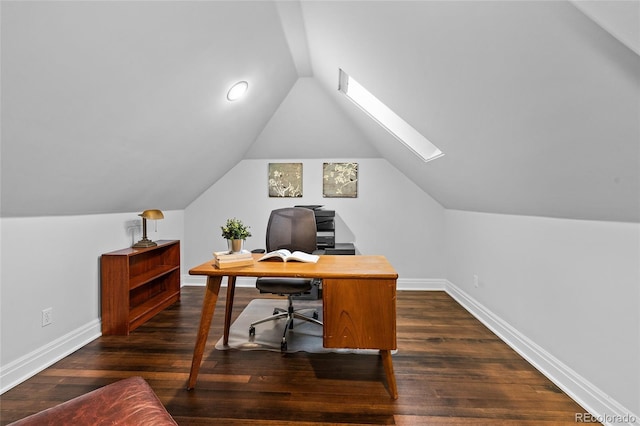 home office featuring vaulted ceiling with skylight, baseboards, and dark wood finished floors