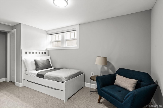 carpeted bedroom featuring baseboards