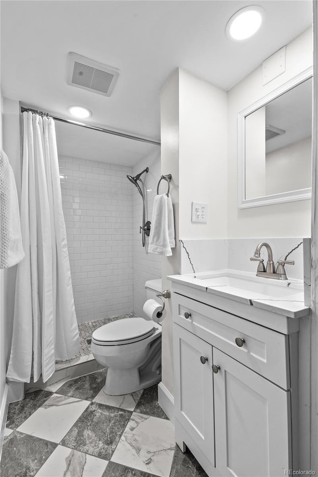 bathroom featuring a stall shower, visible vents, toilet, marble finish floor, and vanity