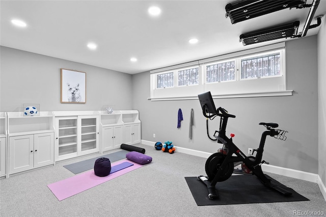 exercise room with baseboards, carpet flooring, and recessed lighting