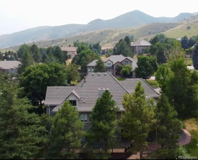 birds eye view of property featuring a mountain view