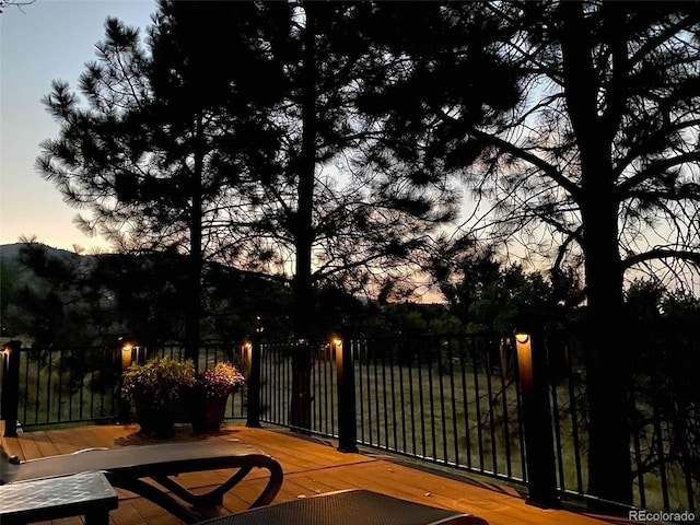 exterior space featuring fence and a deck