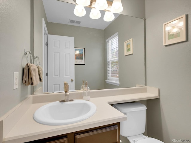 1234 Riddlewood Ln, Highlands Ranch, CO 80129 - half bath featuring vanity and a chandelier