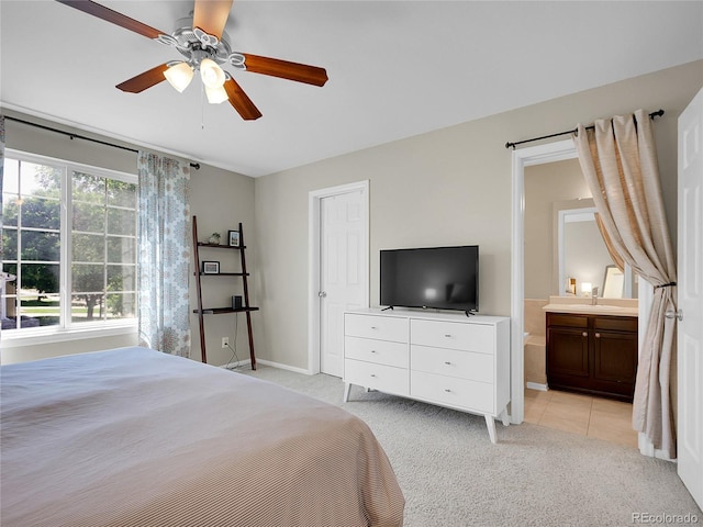 1234 Riddlewood Ln, Highlands Ranch, CO 80129 - bedroom featuring light carpet, ensuite bathroom, and ceiling fan