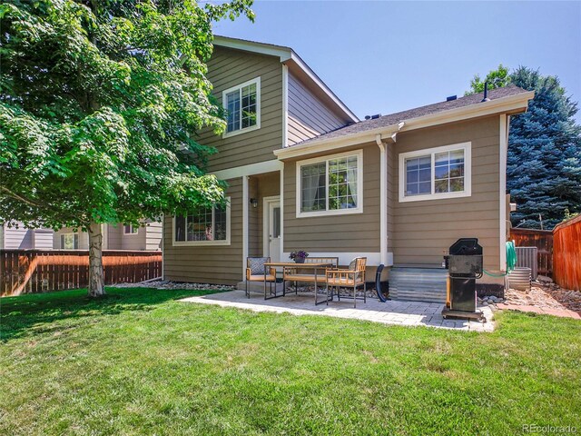 1234 Riddlewood Ln, Highlands Ranch, CO 80129 - back of property with a fenced backyard and a patio area