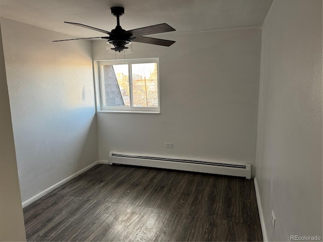 spare room featuring ceiling fan, a baseboard radiator, wood finished floors, and baseboards