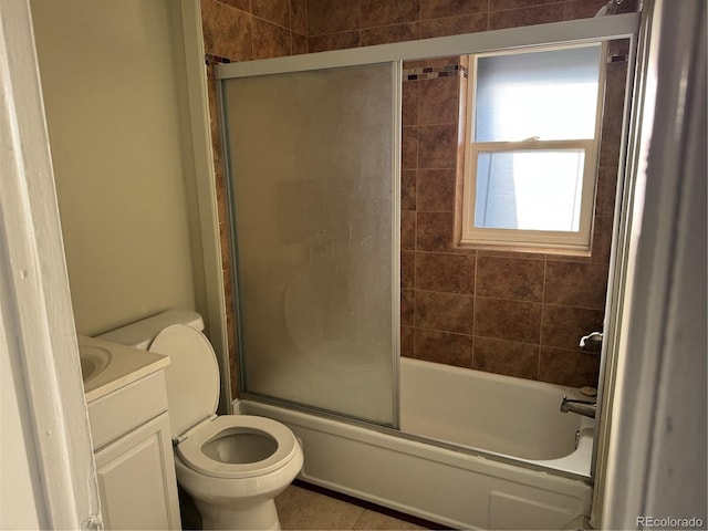 full bath featuring toilet, tile patterned flooring, enclosed tub / shower combo, and vanity