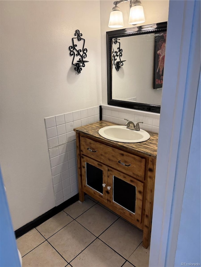 bathroom with tile walls, vanity, and tile patterned floors