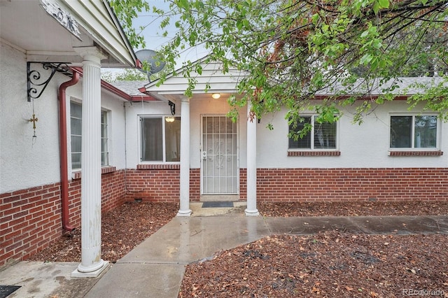 4072 Ames St, Wheat Ridge, CO 80212 - view of exterior entry featuring brick siding