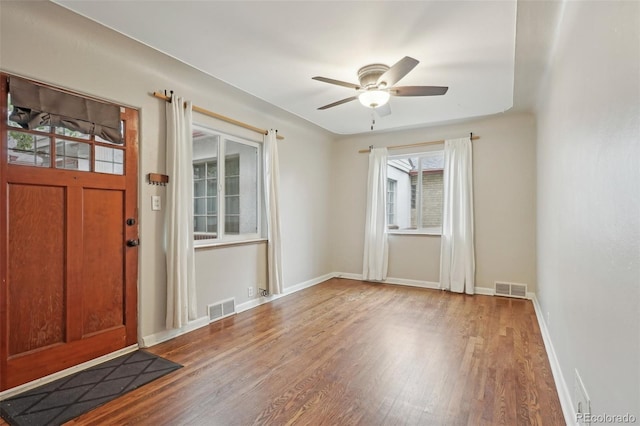 4072 Ames St, Wheat Ridge, CO 80212 - entryway with wood finished floors, a ceiling fan, and baseboards
