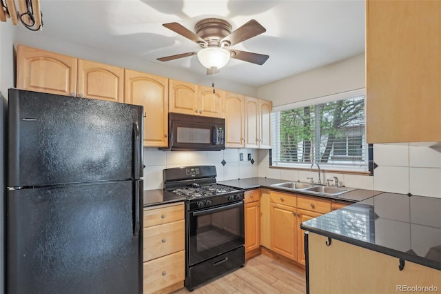 4072 Ames St, Wheat Ridge, CO 80212 - kitchen featuring black appliances, a sink, light brown cabinetry, and dark countertops