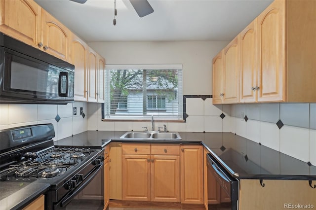 4072 Ames St, Wheat Ridge, CO 80212 - kitchen featuring black appliances, a sink, and dark countertops