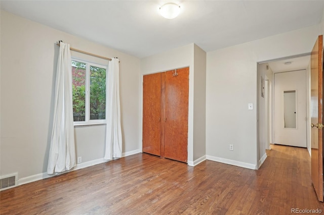 4072 Ames St, Wheat Ridge, CO 80212 - unfurnished bedroom featuring wood finished floors, baseboards, and a closet