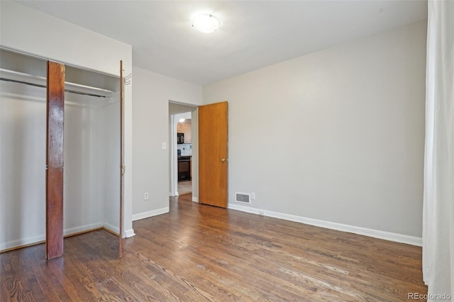 4072 Ames St, Wheat Ridge, CO 80212 - unfurnished bedroom with wood finished floors, baseboards, and a closet