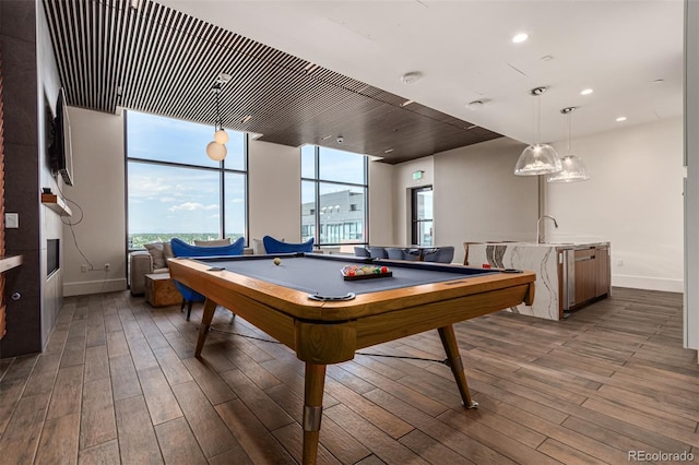 game room with pool table and hardwood / wood-style floors