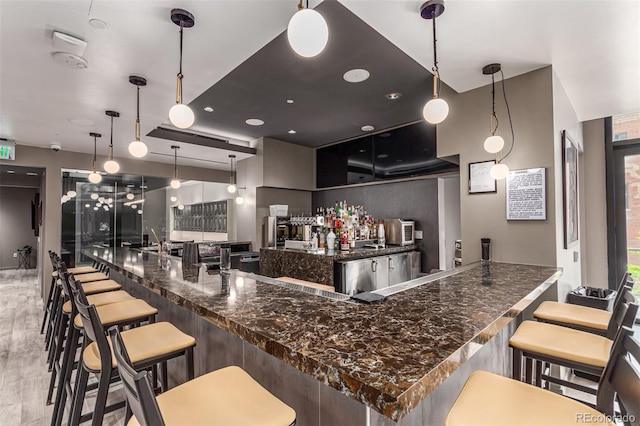 kitchen with pendant lighting and a breakfast bar