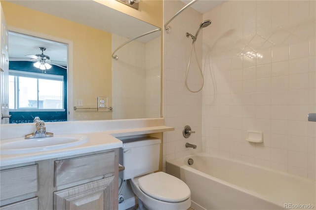 full bath with vanity, a ceiling fan, toilet, and bathing tub / shower combination