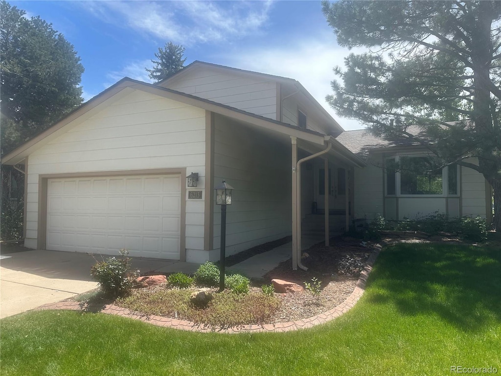 view of property exterior featuring a garage, concrete driveway, and a lawn