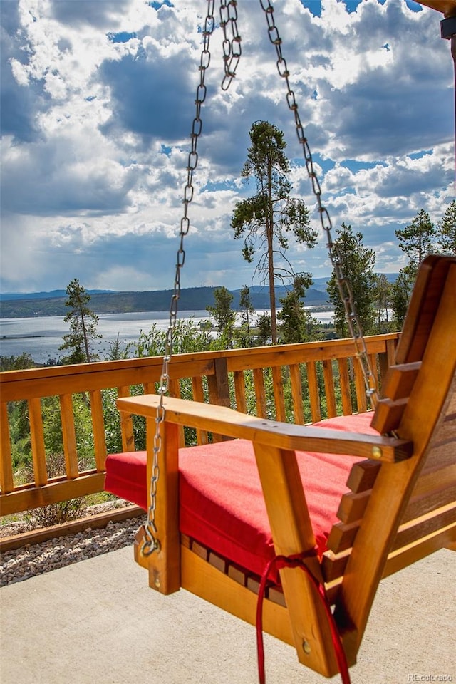 wooden terrace with a water view