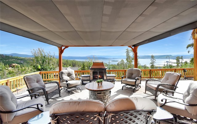 view of patio featuring an outdoor living space and a mountain view