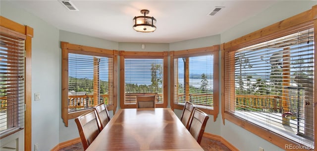 dining room with baseboards and visible vents