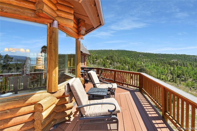 deck featuring a wooded view